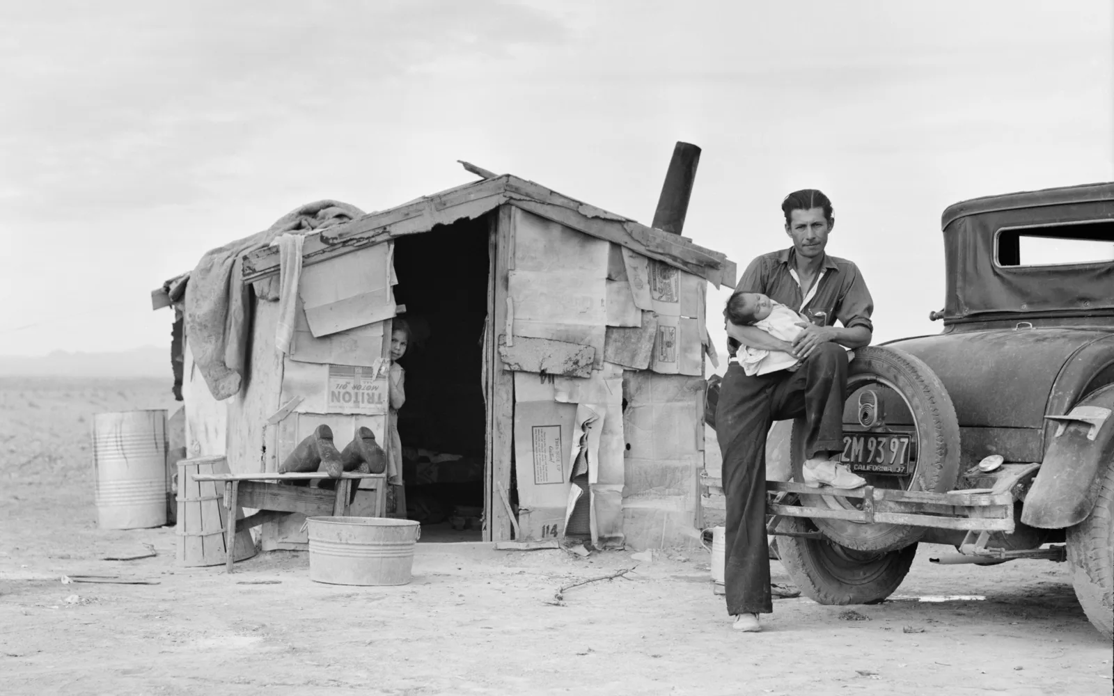 Historical photograph of farm work in Imperial Valley, California showing agricultural labor and pea field